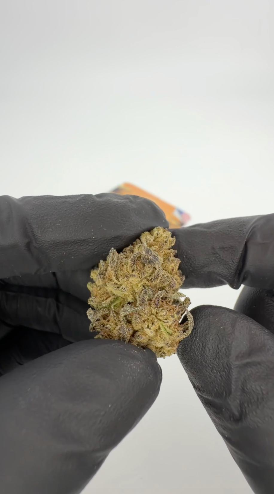 California Love THCA indoor flowers—dense light-green dried cannabis flower on neutral background; ROLLZ own production.